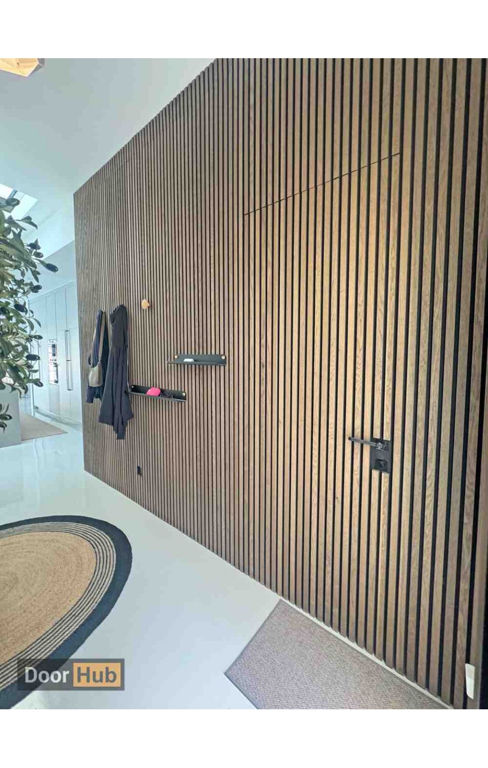 Travertini Concealed Door UAE with Acoustic Slat Wall Panel System